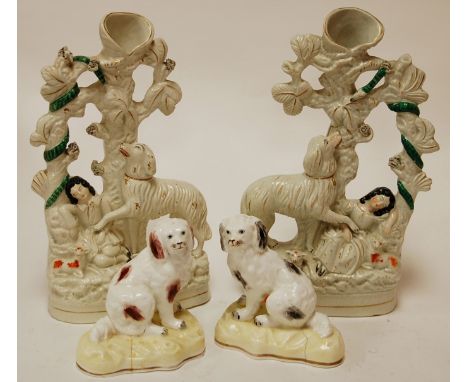 A pair of Victorian Staffordshire flatback spill vases, each modelled as a sleeping figure with attendant dog and serpent; to
