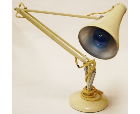 A cream angle poise desk lamp