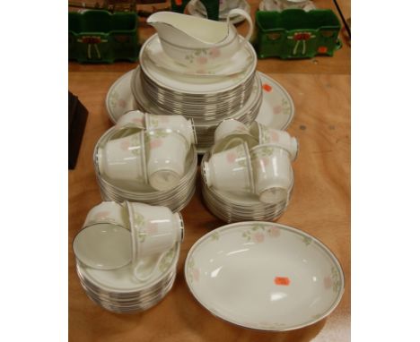 A Royal Doulton part tea and dinner service in the Twilight Rose pattern