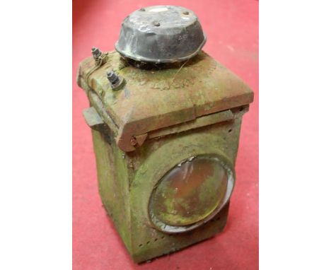 An early 20th century iron cased railway lantern by The Lamp Manufacturing Railway Supplies Ltd of London, Patent No. 196218H