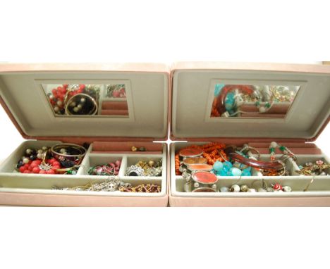 A large collection of assorted costume jewellery to include gold plated bangle, faux coral necklace, paste set brooch etc