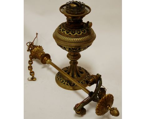 An early 20th century brass three light electrolier together with a pierced brass oil lamp (2)