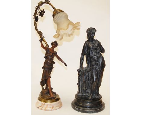 An Art Nouveau style spelter figural table lamp having frilled glass shade on a marble socle base together with a spelter fig