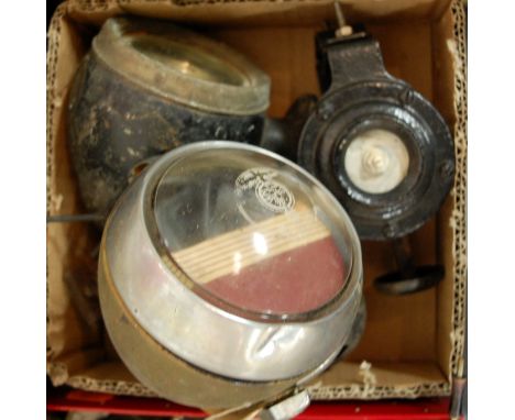 An early 20th century Lucas cycle lamp with homemade wartime blackout; together with two other cycle lamps and an early motor