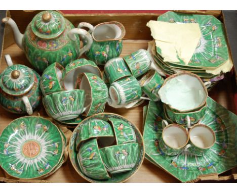 A mid 20th century Chinese porcelain tea/coffee service on a green ground decorated with butterflies Condition Report / Extra