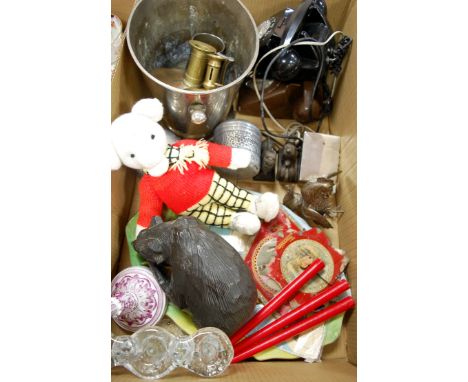 A box of miscellaneous items to include; ice bucket, bakelite telephone, brass candlestick, carved Black Forest style softwoo