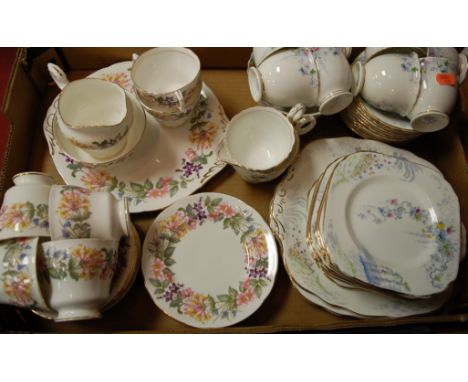 A Paragon part tea service in the Country Lane pattern; together with a Sutherland part tea service 