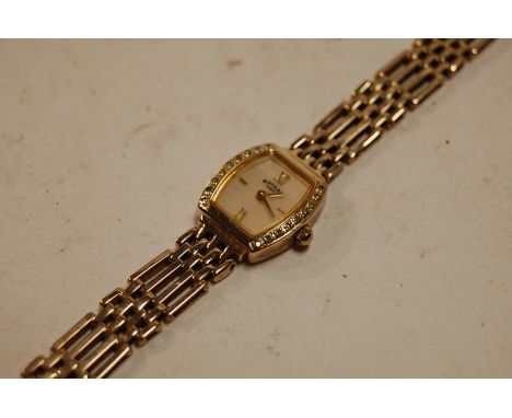 A Rotary 9ct gold cased ladies bracelet watch, having signed mother of pearl dial, flanked to either side with nine small rou