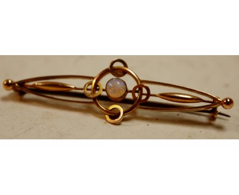 An early 20th century yellow metal and opal set openwork bar brooch, in Charles Packer & Co of Regent Street fitted leather b