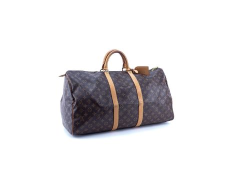 Louis Vuitton Brown Monogram Coated Canvas Keepall Travel Bag 55. Golden brass hardware. Brown canvas interior. Luggage tag, 
