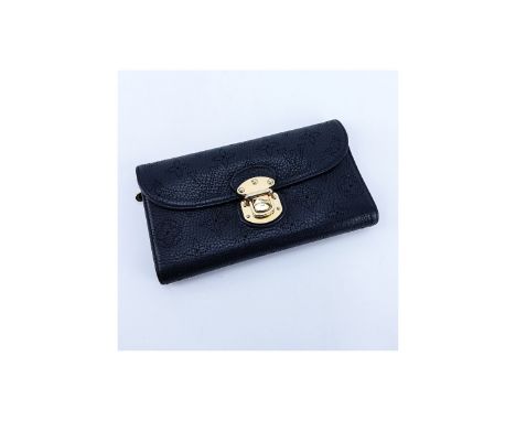 Louis Vuitton Black Monogram Empreinte Leather Amelia Wallet. Golden brass hardware, interior card slots and zippered pocket.