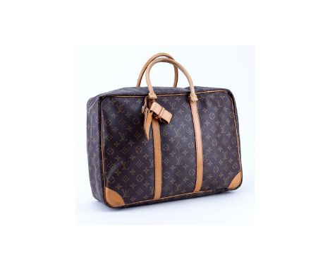 Louis Vuitton Brown Monogram Coated Canvas Sirius 45 Travel Bag. Golden brass hardware, beige interior, vachetta leather. Lug