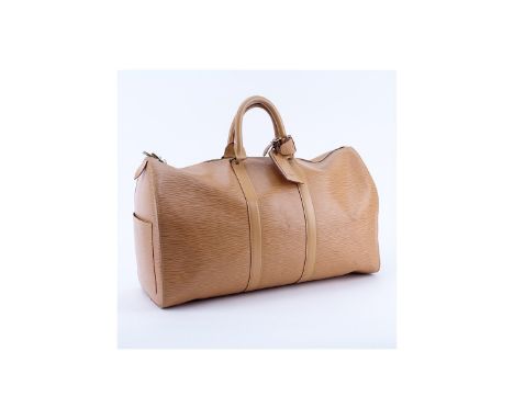 Louis Vuitton Light Beige Epi Leather Keepall Travel Bag. Golden brass hardware, beige leather interior, luggage tag. Labeled