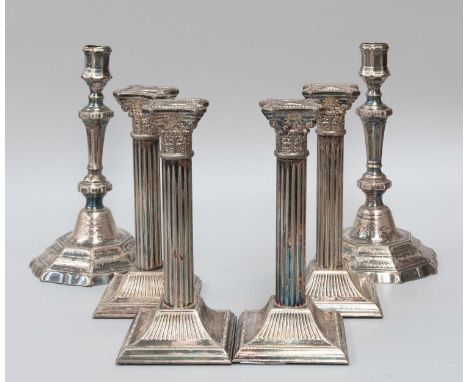 A Set of Four Silver Plate Candlesticks, each on square base with beaded borders and fluted sides, terminating in a Corinthia