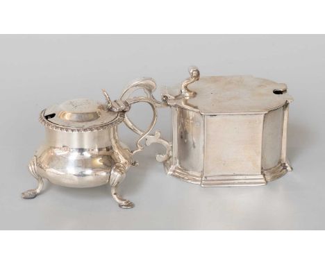 A George V Silver Mustard-Pot, by Samuel Walton Smith, London, 1913, shaped oval and with scroll handle, the hinged cover wit
