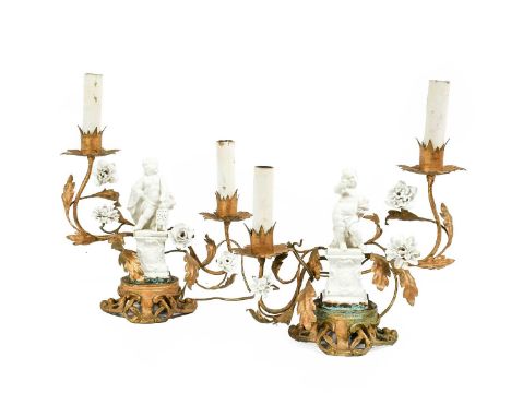 A Pair of Gilt Metal and White Porcelain Twin-Light Candelabra, 18th century style, mounted as table lamps, each surmounted b