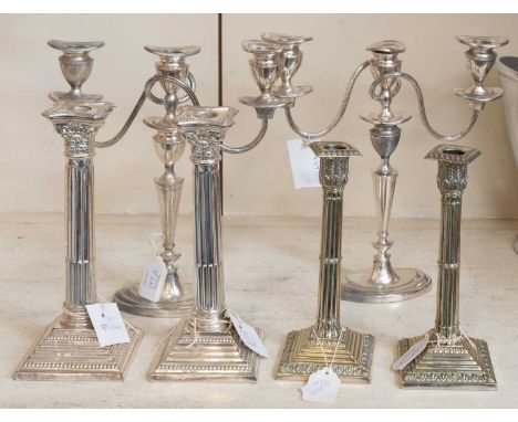 Two Pairs of Silver Plate Candlesticks, with differing stepped square bases, one pair with Corinthian capital sockets and one