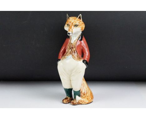 Rye Cinque Ports Pottery figure of a fox in red hunting coat, signed marks CPP Rye and artist's initials MC, 24cm high 