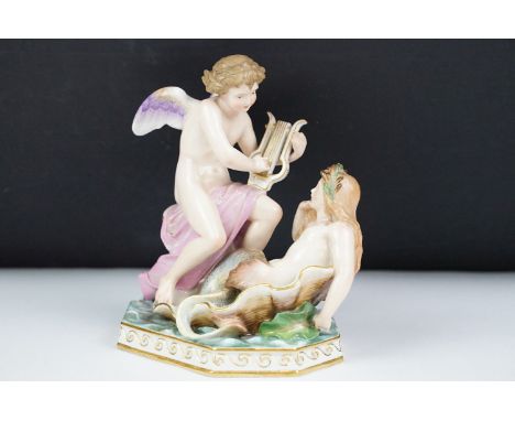 Meissen figure of an angel playing a lyre and a mermaid, blue crossed swords mark to base, incised number to base G148, 17cm 