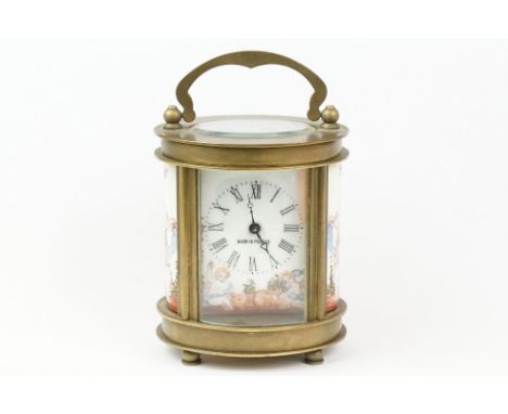 An antique French miniature carriage clock, brass cased with beveled glass panels, decorative Cherub enamel decoration, compl