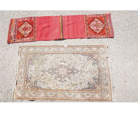 Middle Eastern cream ground carpet, with central stylised motif within geometric borders, 160 x 92cm together with a red grou