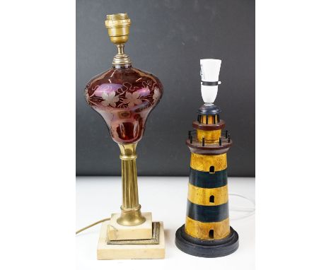 Red flash glass table lamp with grape vine decoration, raised on a stepped glass base, together with a novelty wooden table l