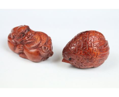 Two Chinese carved wooden Netsuke with one being in the form of a bird. 