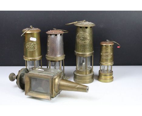 Group of four brass miners lamps to include E. Thomas &amp; Williams Ltd, Ferndale Mining Co., etc (tallest approx 25cm - exc