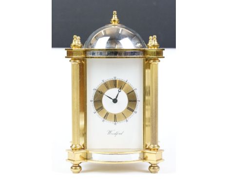 20th century Woodford brass chiming mantel clock of architectural form, with gilt chapter ring and black Roman numeraks, the 