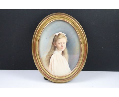 English School, head and shoulders portrait of a girl, watercolour, indistinctly monogrammed lower left and dated 1909, 22 x 