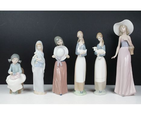 Group of six Lladro &amp; Nao porcelain figurines to include Lladro 4505 Girl with Lamb, Lladro 5007 Bashful Girl Holding Hat