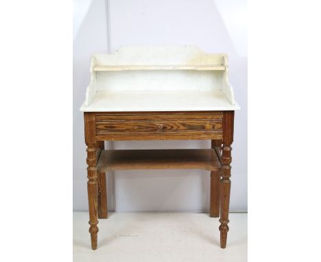 20th century pine washstand, the marble top with shelf above, with one drawer above turned legs and shelf below, 106cm high x