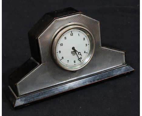 An Art Deco silver mantel clock, 7cm silvered dial inscribed Smiths H-91551, car dashboard type movement, engine-turned mount