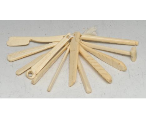 A collection of early 20th century carved bone novelties, possibly prisoner of war, including a hammer, pincers, a fish, a sa