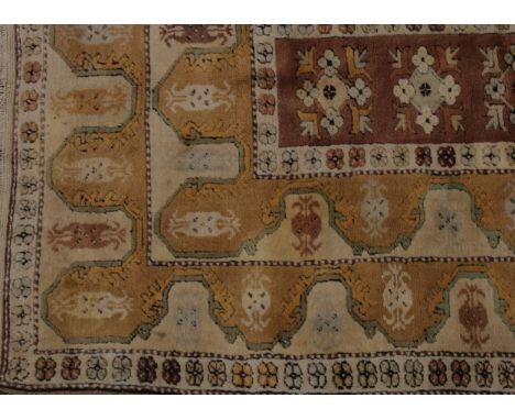A Middle Eastern rug, central rectangular light brown field filled with five stylised gulls, within borders of mustard yellow