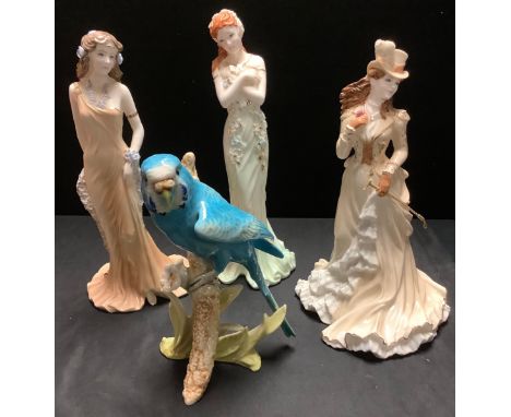 Coalport figures, Topaz, 829/9500; Emerald, 2067/6500; Helena Riding in Hyde Park4251/12500; a Goebel blue budgerigar (4) 