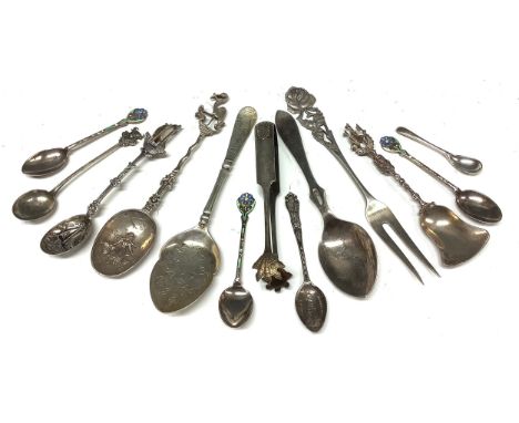 A Victorian silver patisserie spoon, Sheffield 1891; a set of three silver and enamel coffee spoons, London 1928; a Child's s
