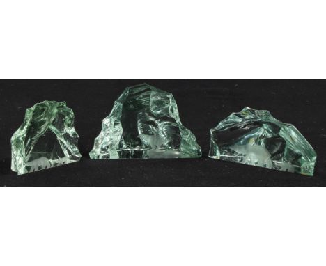 A suite of three Kosta Boda 'iceberg' etched glass sculptures, each intaglio cut with Polar bears, etched marks, one signed V