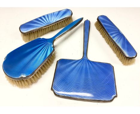 An Art Deco silver and guilloche enamel dressing table brush, Adie Brothers Ltd, Birmingham 1935; a similar mirror and a pair