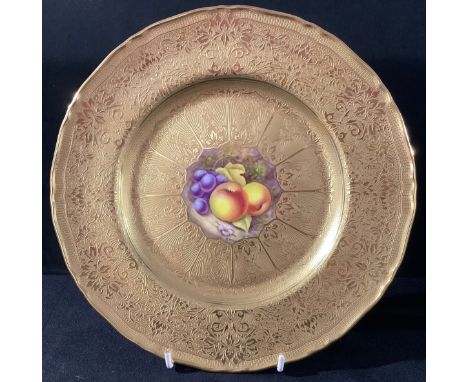 A Royal Worcester shaped circular cabinet plate, painted by R Price, signed, the central cartouche painted with ripe fruits o