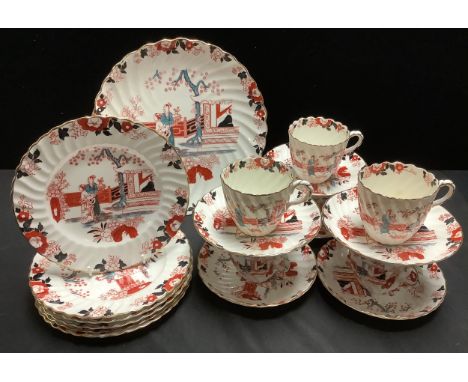 An early 20th century Staffordshire spirally fluted tea service, decorated in the chinoiserie manner, c.1910 