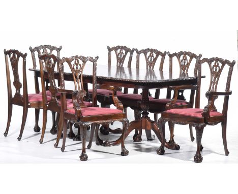 A Chippendale style twin pedestal table and eight conforming chairs, 20th CenturyThe oval table with a gadroon border support