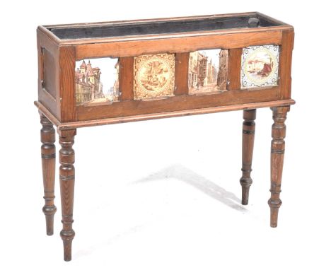 A Victorian pitch pine and tiled planterOf rectangular form with a metal tray liner, each side inset with four coloured ceram