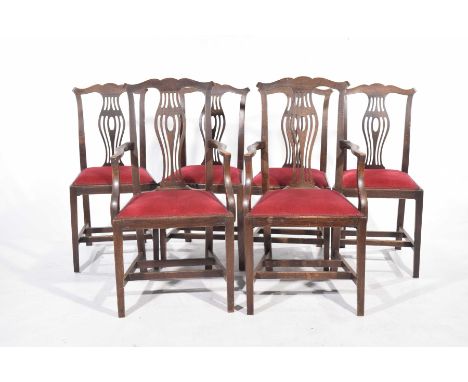 A set of six Chippendale style oak dining chairs, early 20th CenturyEach with a pierced splat back above a padded seat raised