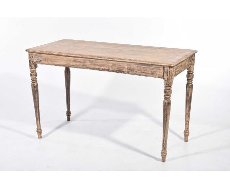 A scumbled and stained hardwood kitchen table 
The rectangular moulded top with rounded corners supported on ring turned tape