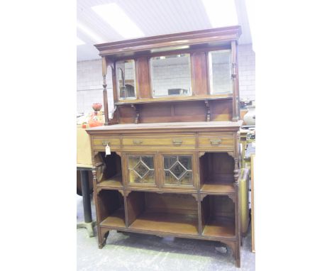 An Edwardian mahogany mirror back chiffonierSuperstructure raised back with three bevelled mirrors above a shaped shelf, the 