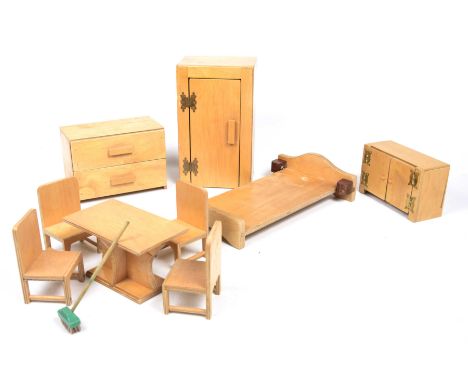 A collection of vintage child's dolls house itemsTo include table and four chairs, bed frame, side cabinet, twin door side ca