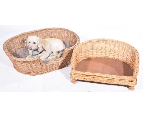 Two vintage wickerwork dog bedsLargest approximately 90cm wide.(2)