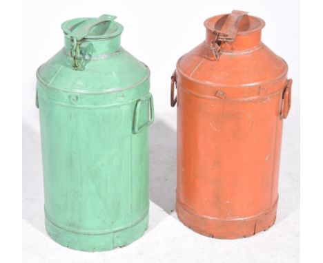 Two vintage painted metal milk churns Of typical cylindrical form rising to a domed top with hinged lid and twin handles, one