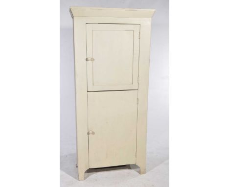 A rustic painted hardwood two door cabinet
The two doors with knob handles enclosing a vacant interior, raised on shaped brac